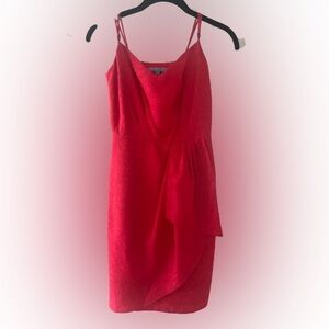 Embrace the allure of the stunning red spaghetti string dress. For any occasion!